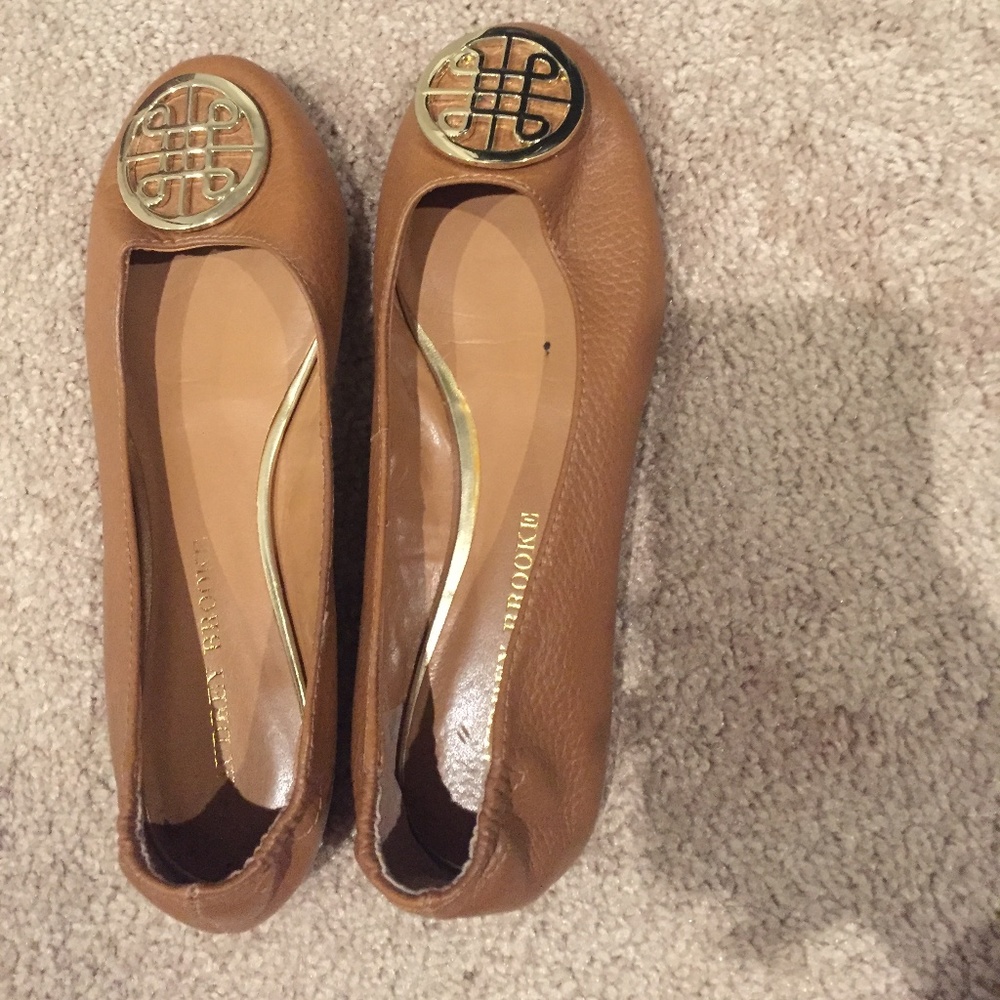 Selling brown flats with gold design buckle